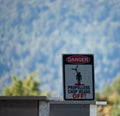 A danger sign saying: Propellers chop heads off! in a parachute center near Franz Josef in New Zealand Royalty Free Stock Photo