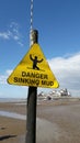 Danger sinking mud sign weston beach Royalty Free Stock Photo