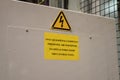 Danger symbol industrial sign with warning symbol for electrocution electricity on control panel casing in yellow