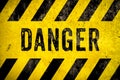 DANGER warning sign word text yellow black stripes concrete wall cement texture background. Danger dangerous warning Royalty Free Stock Photo