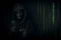 Dangerous anonymous hacker in hooded and mask use smartphone and credit card, break security data and hack password with Bank data