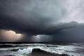 Dangerous approaching storm over ocean natural disaster background with broken wavy foamy water surface under dark blue