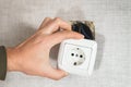 Dangerous bad,broken socket,plug in bathroom,falling out of wall. Outlet installation in old apartment. Poor electrical Royalty Free Stock Photo