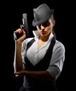 Dangerous and beautiful criminal girl with gun Royalty Free Stock Photo