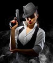 Dangerous and beautiful criminal girl with gun Royalty Free Stock Photo