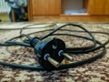 Black electric cable to the vacuum cleaner with a plug