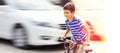 Dangerous city traffic situation with a boy on bicycle Royalty Free Stock Photo