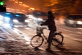 Dangerous city traffic situation with cyclist and car in the cit Royalty Free Stock Photo