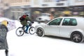 Dangerous city traffic situation with cyclist and car Royalty Free Stock Photo