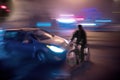 Dangerous city traffic situation with cyclist and car Royalty Free Stock Photo