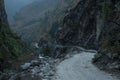 Dangerous curvy winding mountain road at Dharapani village over Marshyangdi river Royalty Free Stock Photo