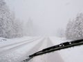 Dangerous driving during blizzard on rural highway Royalty Free Stock Photo