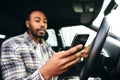 Dangerous Driving From Man Texting On Mobile Phone With One Hand On Steering Wheel Royalty Free Stock Photo