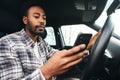 Dangerous Driving From Man Texting On Mobile Phone With One Hand On Steering Wheel Royalty Free Stock Photo