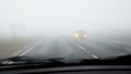 Dangerous driving on road in fog Royalty Free Stock Photo