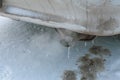 Dangerous freezing of the exhaust pipe of the car in extreme cold during long parking and heating of the passenger compartment Royalty Free Stock Photo