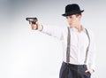 Dangerous gangster in hat aims a pistol Royalty Free Stock Photo