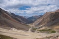 Dangerous gravel mountain road to Kumtor gold mine. Serpentine road to Barskoon mountain pass. Travel, tourism in Kyrgyzstan