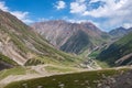 Dangerous gravel mountain road to Kumtor gold mine. Serpentine road to Sarymoynak mountain pass. Travel, tourism in Kyrgyzstan