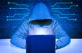 Dangerous hacker behind a laptop screen. Hacking and malware concept, cybersecurity.