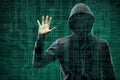 Dangerous hacker over abstract digital background with binary code. Obscured dark face in mask and hood. Data thief Royalty Free Stock Photo