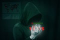 Dangerous hacker stealing data over screen with binary code. Royalty Free Stock Photo