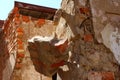 Dangerous hanging brick debris on the building