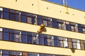 Dangerous high-altitude work on a building Royalty Free Stock Photo