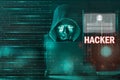 Dangerous Hooded hacker man using laptop with binary code digital interface