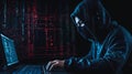 Dangerous hooded hacker. An Hacker working alone. Royalty Free Stock Photo