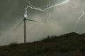 Dangerous lightning on wind turbine on the hill Royalty Free Stock Photo