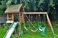 Dangerous live downed power line draped across backyard playground Royalty Free Stock Photo