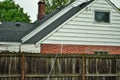 Dangerous live downed power line draped across fence Royalty Free Stock Photo