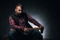 Dangerous-looking axeman. Lumberjack with weapon Royalty Free Stock Photo