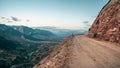 Dangerous narrow cliffside mountain road. Dangerous off road driving along mountain edge and steep cliff. Dagestan