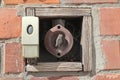Dangerous old bell button on the wall Royalty Free Stock Photo