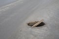 Dangerous opened manhole cover, opened sewerage hatch it the middle of the road Royalty Free Stock Photo