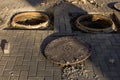 Dangerous opened manhole hole cover. Construction work Royalty Free Stock Photo