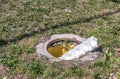 Dangerous opened manhole hole cover, danger for people who walking on the grass in the park in the city Royalty Free Stock Photo