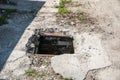 Dangerous opened manhole hole cover, danger for people who walking on the street in the city Royalty Free Stock Photo