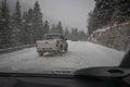 Dangerous overtaking on snowy slippery road by an SUV od pick up vehicle. SUV owners think they own the road