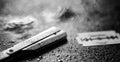 A dangerous razor and a metal blade on the table. Men`s shaving Royalty Free Stock Photo