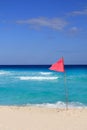 Dangerous red flag in beach rough sea signal Royalty Free Stock Photo