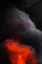 Flames strong red fire, motion blur dramatic clouds of black smoke covered sky Royalty Free Stock Photo