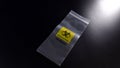 Biohazard waste bag on dark background