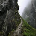 Dangerous road, path under a rock over a cliff, on the edge of an abyss, risk, danger, mountain tourism