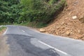 A dangerous rocky road in a mountainous landslide steep area