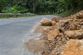 A dangerous rocky road in a mountainous landslide steep area