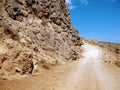 Dangerous running along the slope gravel road to Balos Crete