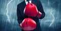 Businessman boxing in rain Royalty Free Stock Photo